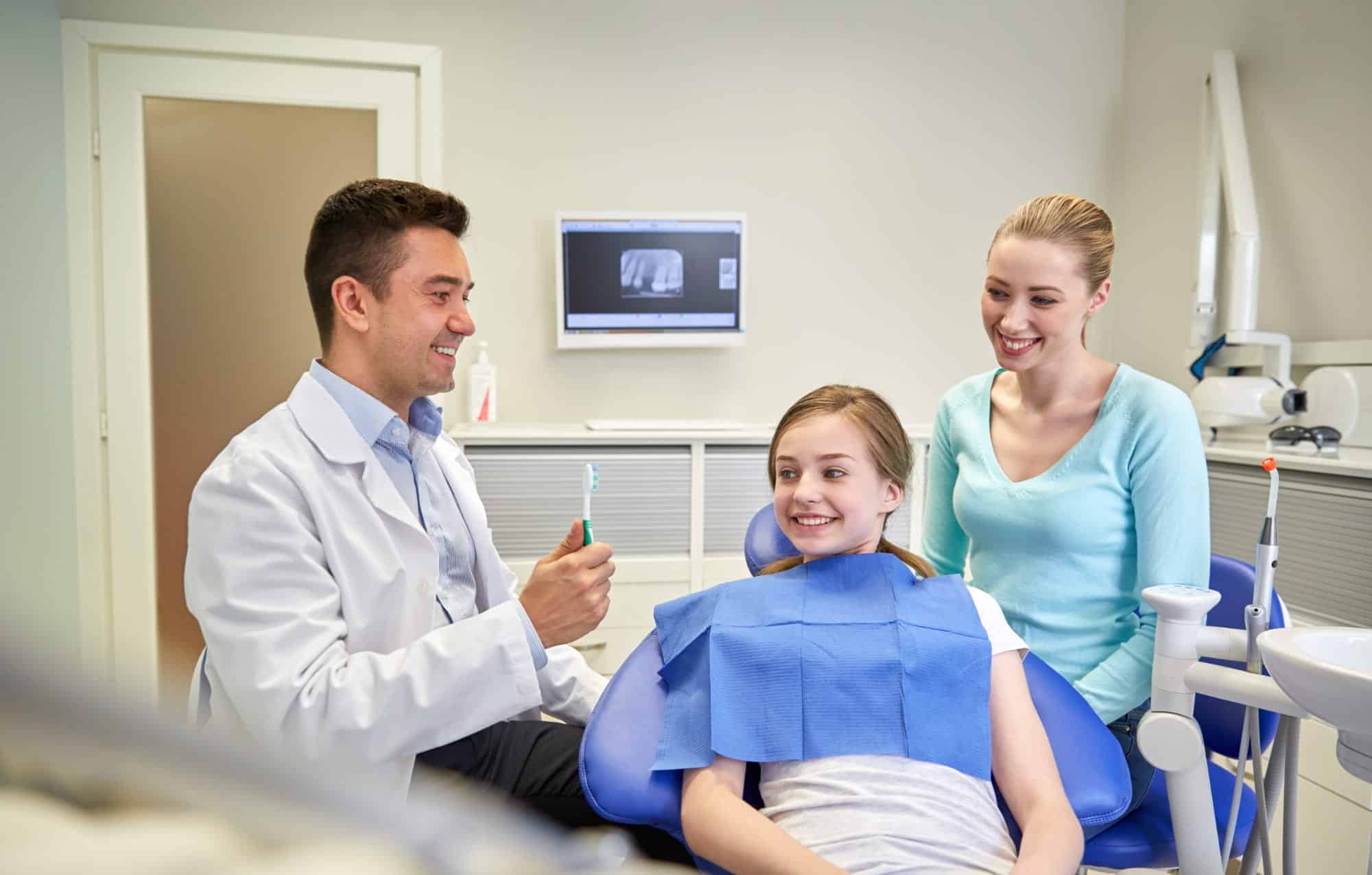 Family dentist with a parent and child at Rose City Dental in Windsor, Ontario